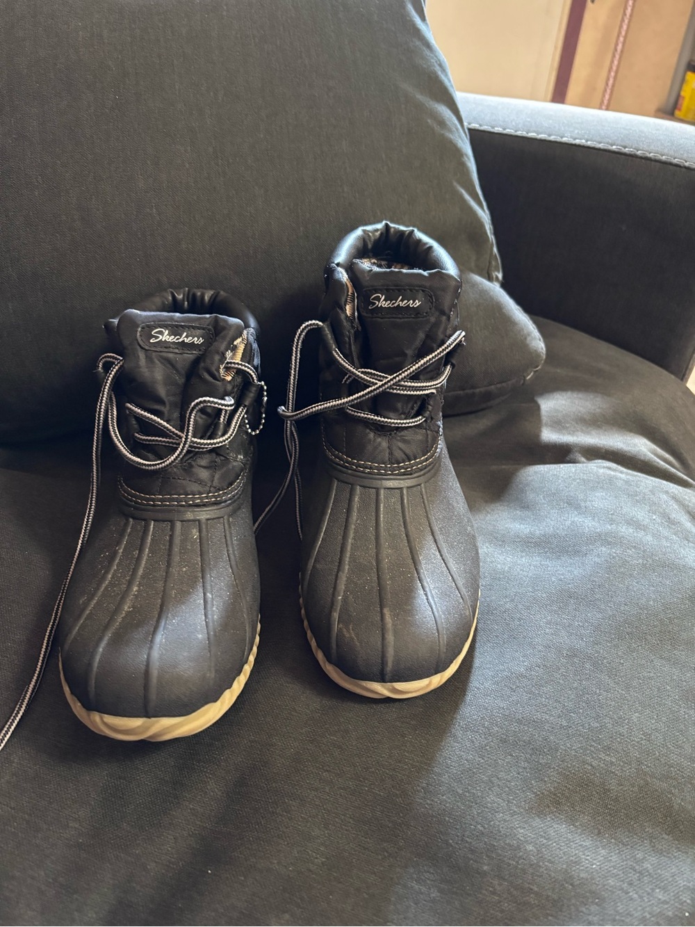 Skechers woman’s Black and Tan Waterproof boots